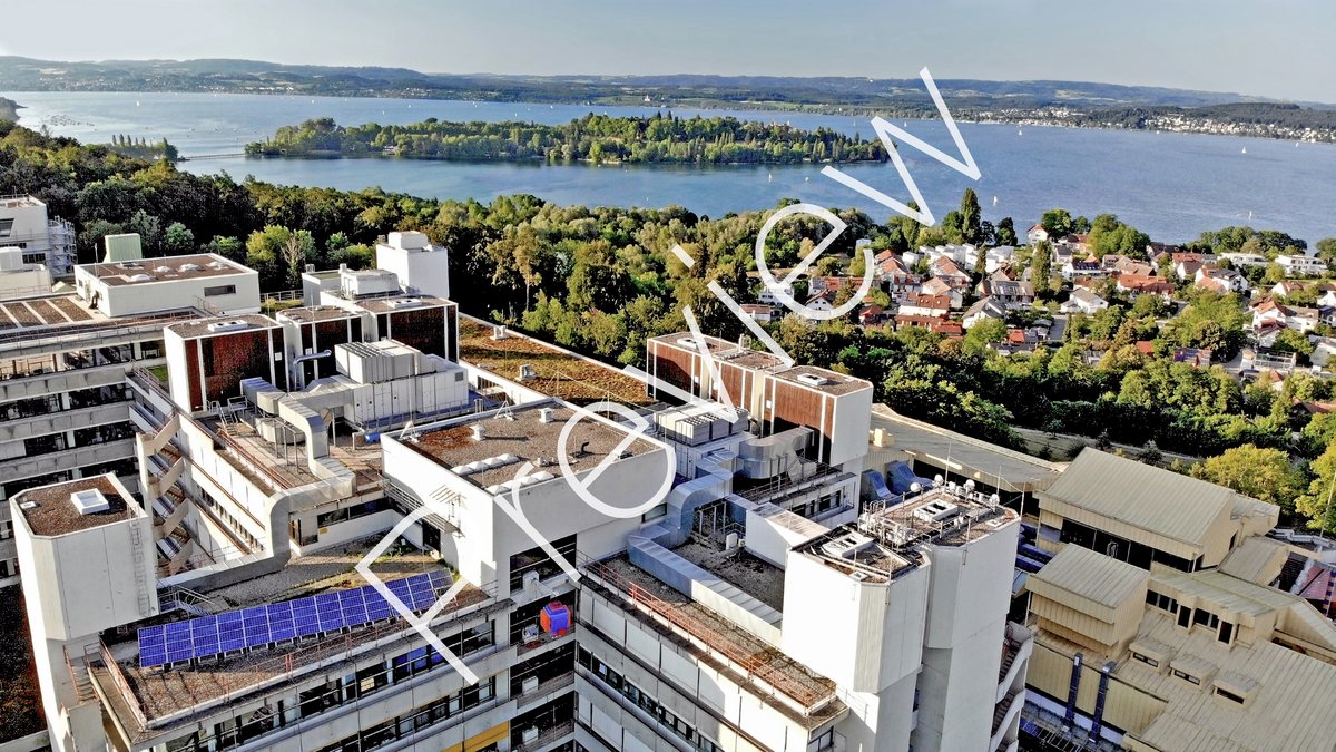 Aerial view of building L,M and lake with Mainau island in the background (with "Preview" watermark)