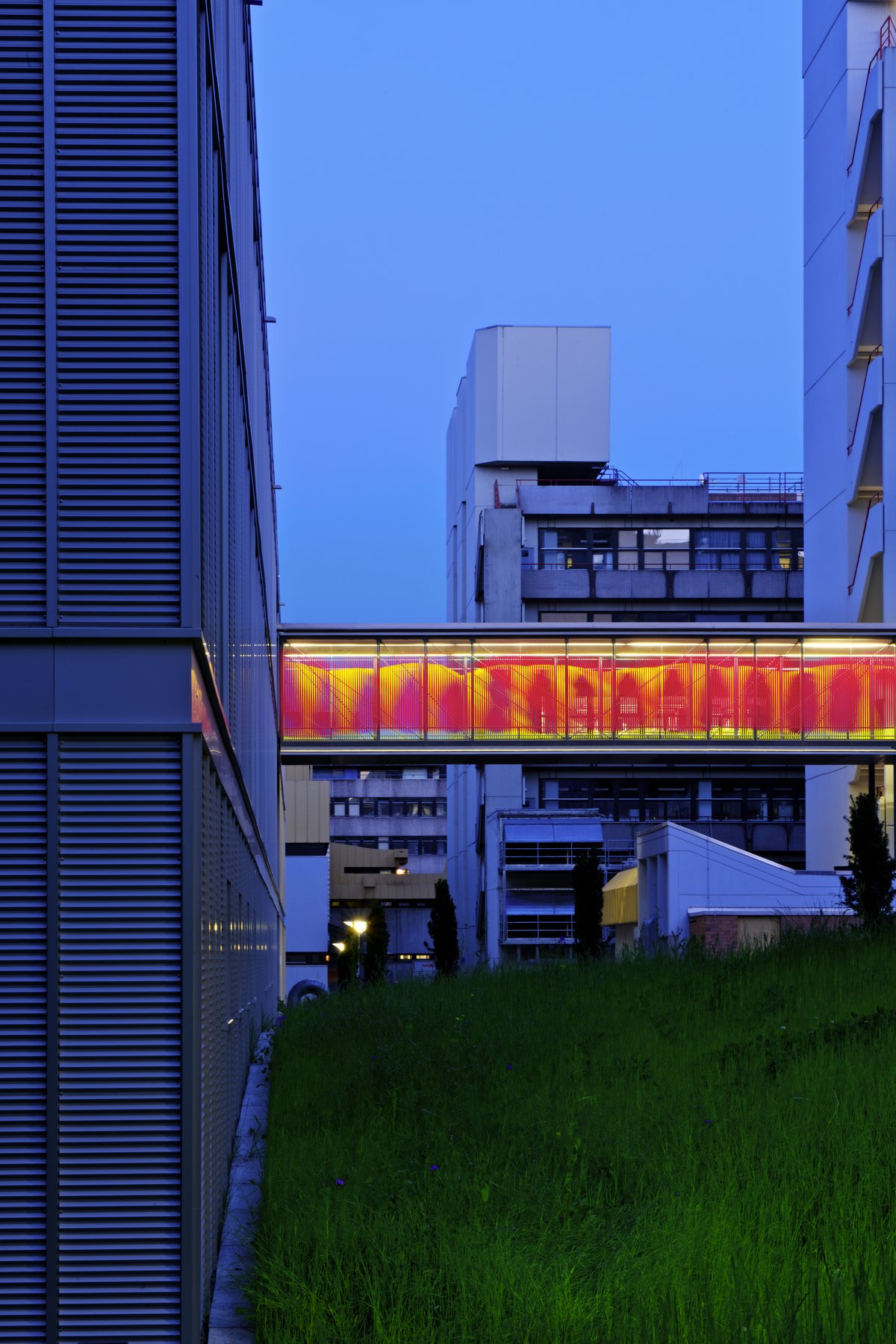 Light channel illuminated in orange-red between buildings M and ML