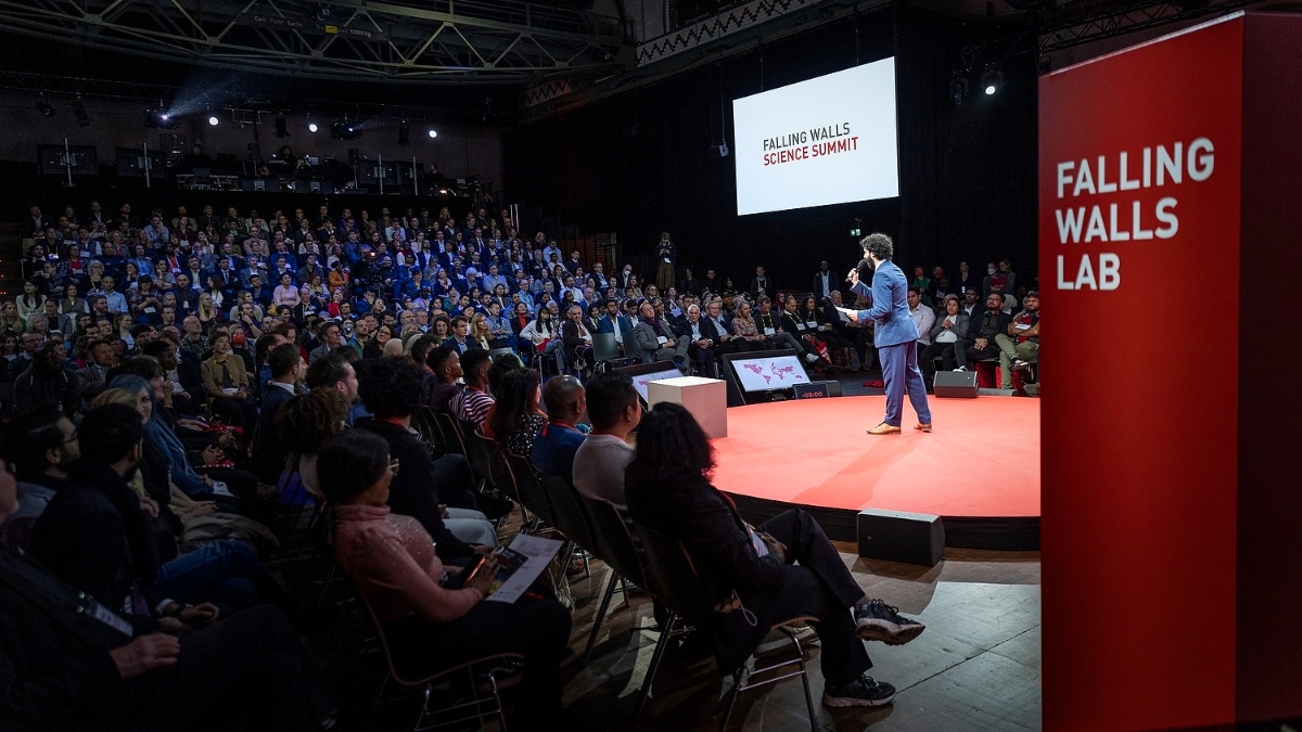 Stage with speakers and audience at the Falling Walls Summit Berlin 2023